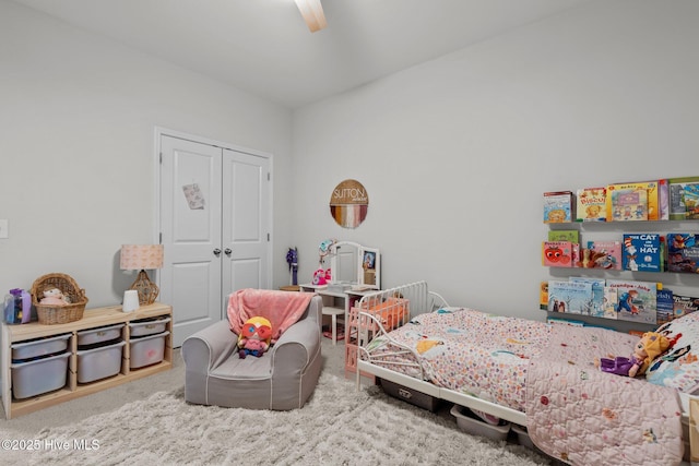 bedroom featuring carpet floors, a closet, and ceiling fan