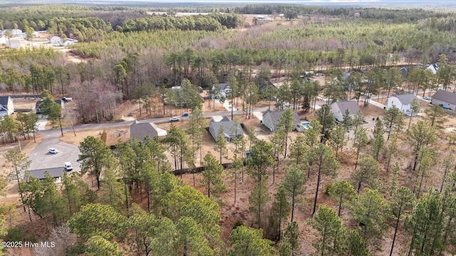 drone / aerial view with a view of trees