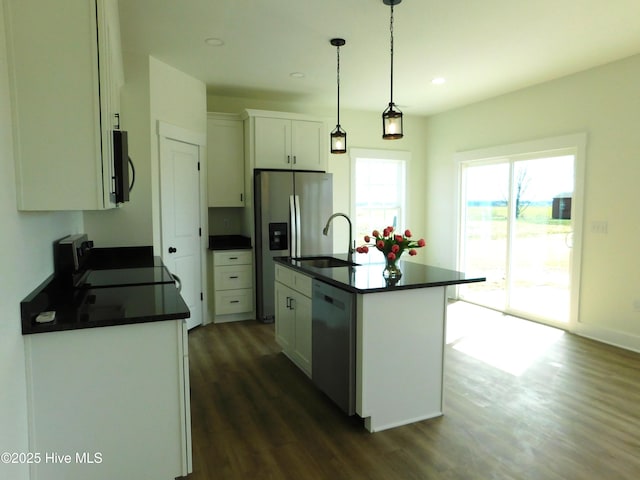 kitchen with dishwasher, black microwave, dark countertops, and range