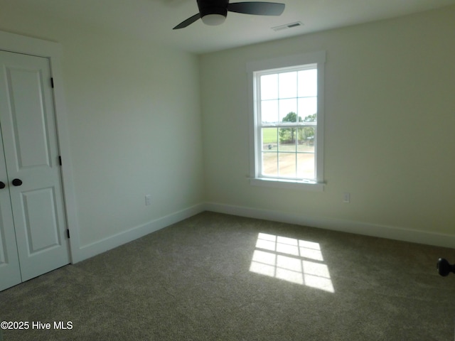 unfurnished bedroom featuring ceiling fan, carpet floors, and baseboards