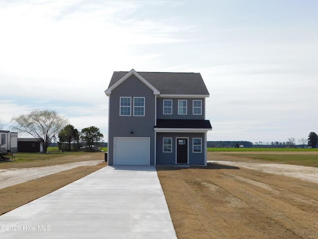 view of front of home featuring a garage and driveway