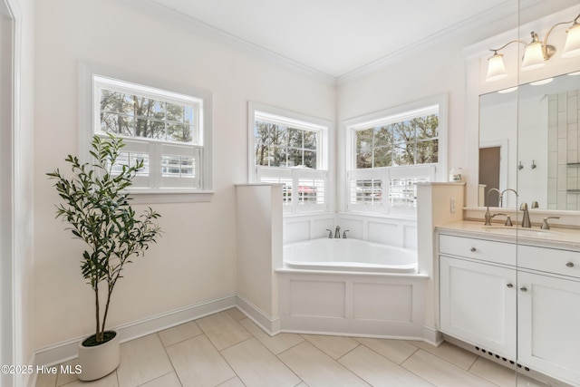 full bathroom featuring a garden tub, ornamental molding, tile patterned flooring, baseboards, and vanity