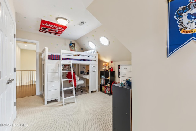 carpeted bedroom featuring visible vents and vaulted ceiling