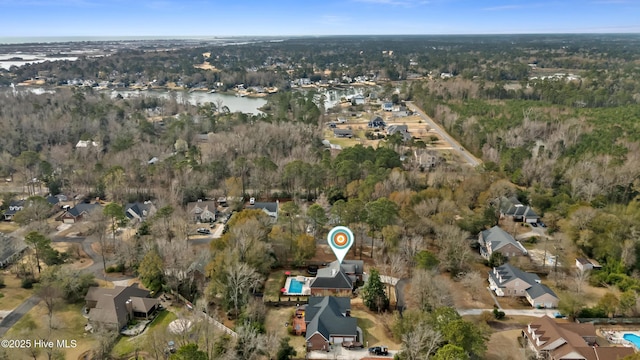 drone / aerial view featuring a residential view and a water view