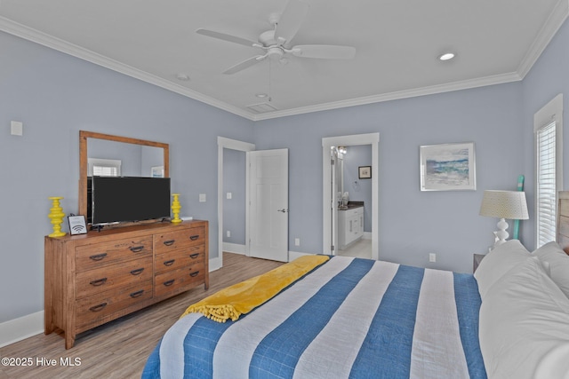 bedroom with ceiling fan, baseboards, light wood-type flooring, ensuite bath, and crown molding