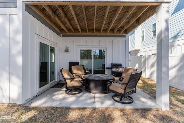 view of patio featuring fence and grilling area