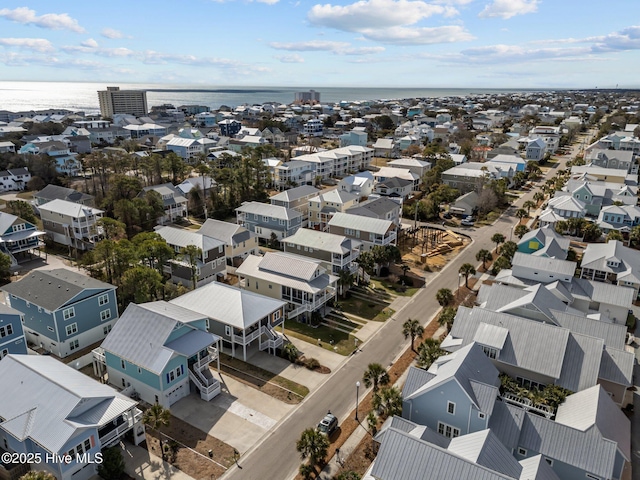 birds eye view of property featuring a water view and a residential view