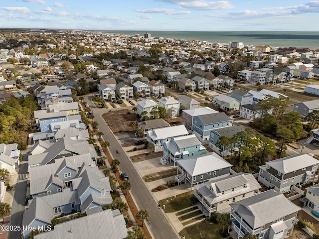 drone / aerial view featuring a residential view and a water view