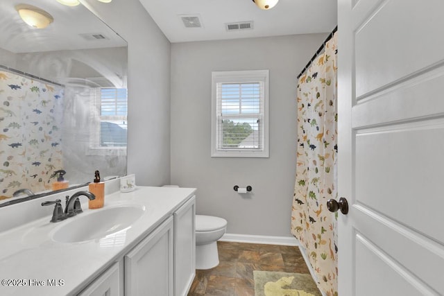 full bathroom with baseboards, visible vents, vanity, and toilet