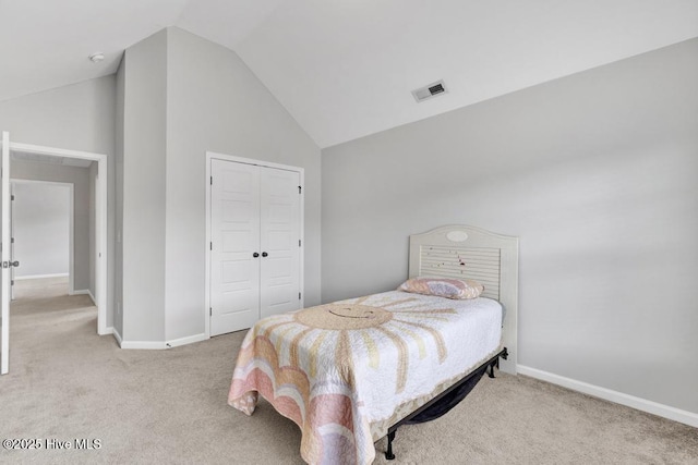 bedroom with lofted ceiling, carpet flooring, visible vents, and baseboards