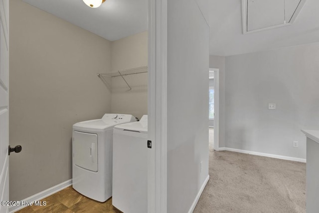 washroom featuring carpet floors, laundry area, baseboards, and washer and clothes dryer