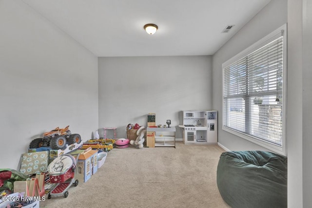 playroom featuring carpet, visible vents, and baseboards