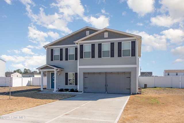 view of front facade featuring a garage, concrete driveway, and fence