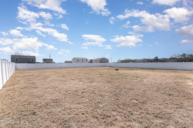 view of yard featuring a fenced backyard