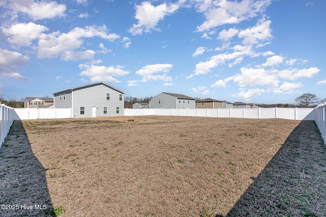 view of yard with a fenced backyard