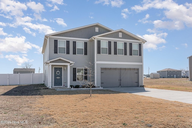 view of front facade with a garage, fence, concrete driveway, and a front yard