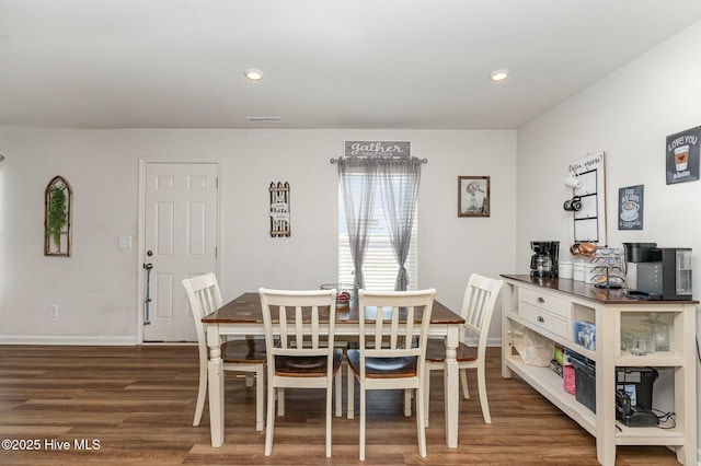 dining space featuring baseboards, wood finished floors, visible vents, and recessed lighting