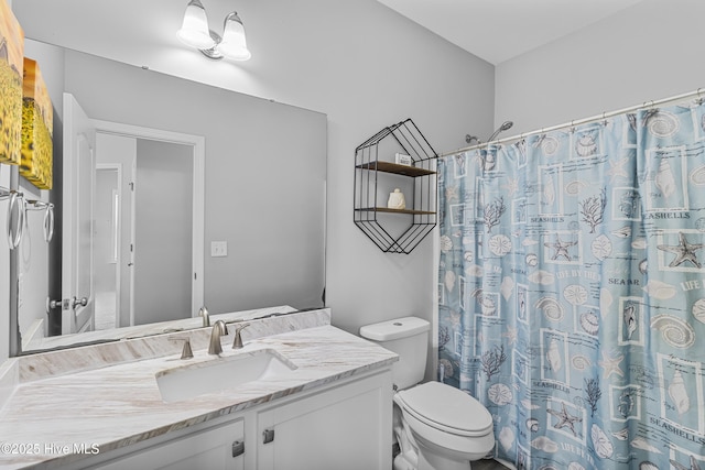 bathroom with a shower with shower curtain, vanity, and toilet