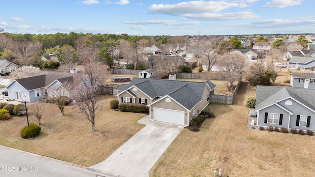 birds eye view of property with a residential view