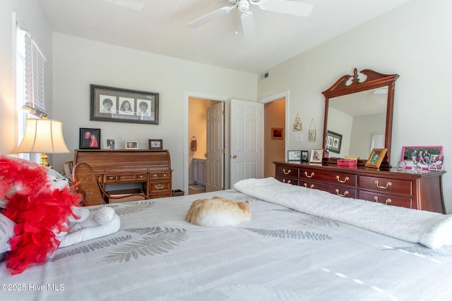 bedroom with ceiling fan, visible vents, and ensuite bathroom