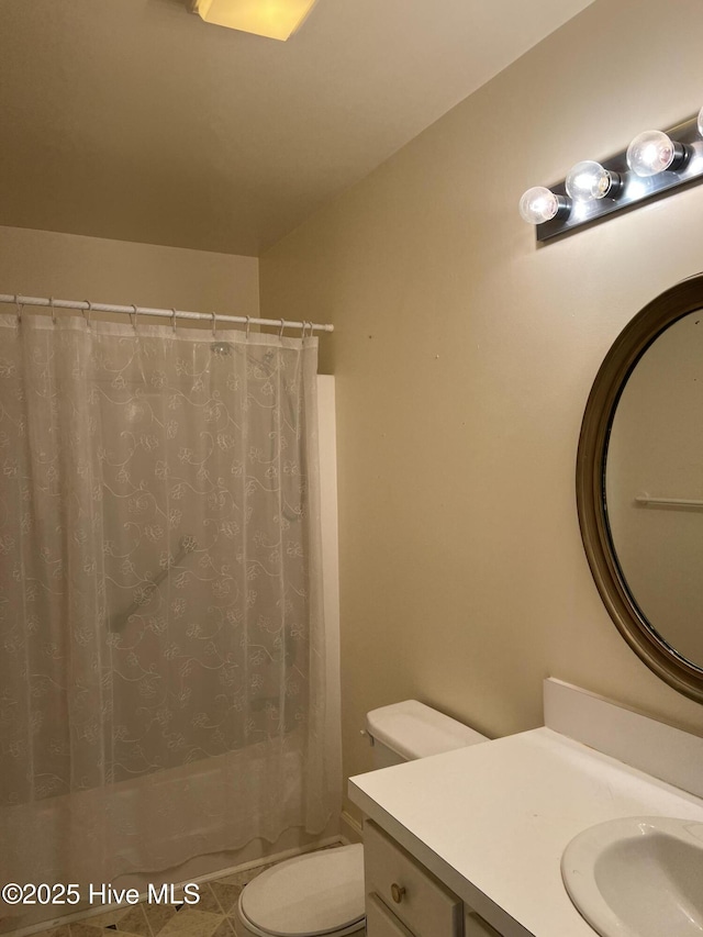 full bathroom with tile patterned flooring, vanity, toilet, and shower / bath combo with shower curtain