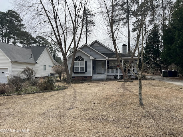 view of front of home with crawl space, covered porch, and a chimney