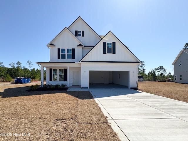 modern inspired farmhouse featuring a garage and driveway