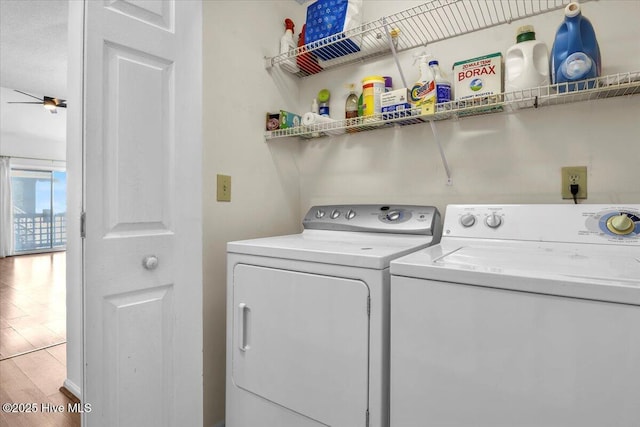 laundry area with laundry area, separate washer and dryer, light wood-type flooring, and a ceiling fan