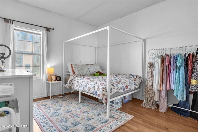 bedroom featuring wood finished floors