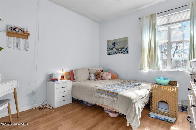 bedroom featuring light wood-type flooring