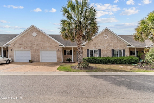 1036 Tideline Dr, Leland, NC 28451 - view of front of property with brick siding, an attached garage, and driveway