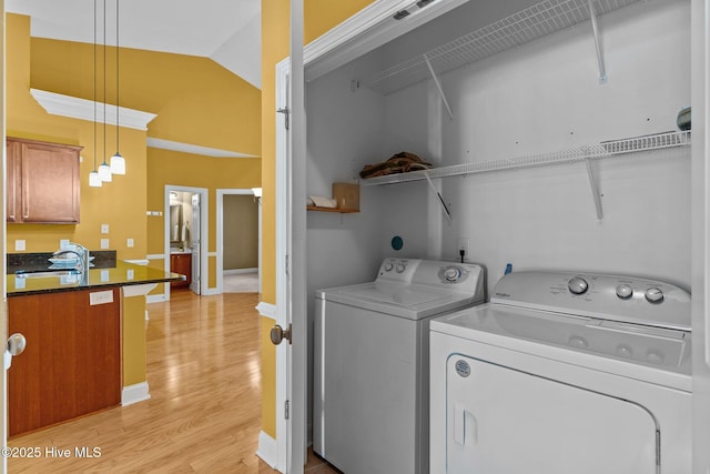 1036 Tideline Dr, Leland, NC 28451 - washroom featuring washing machine and dryer and light wood finished floors