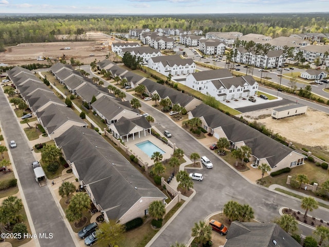 1036 Tideline Dr, Leland, NC 28451 - aerial view of property's location with a forest and a pool area