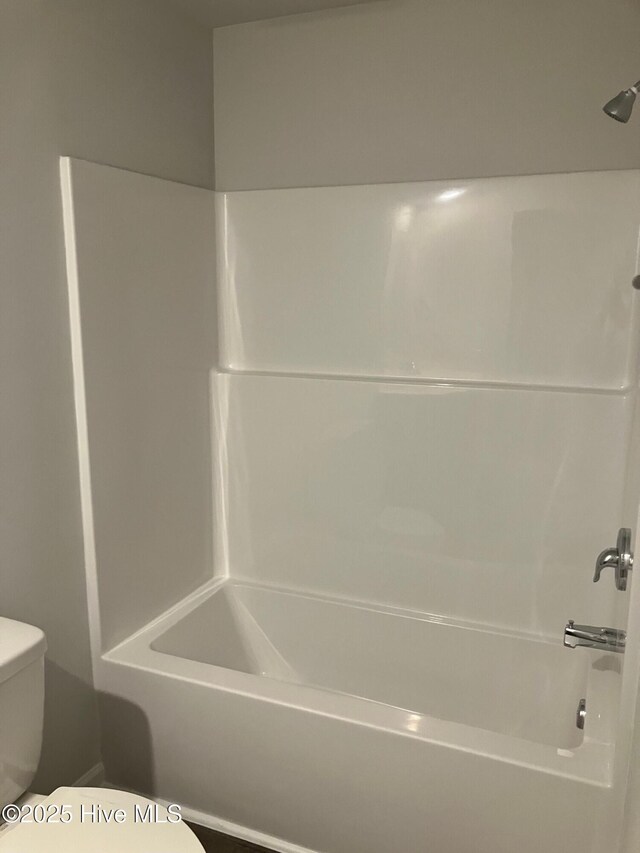 full bathroom with bathtub / shower combination and toilet