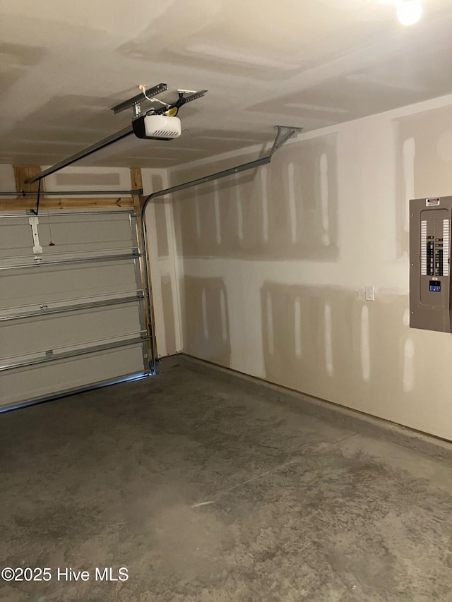 garage with electric panel and a garage door opener