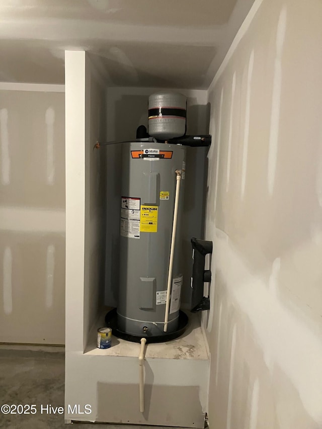 utility room featuring electric water heater