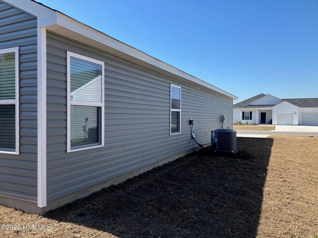 view of property exterior with central AC unit