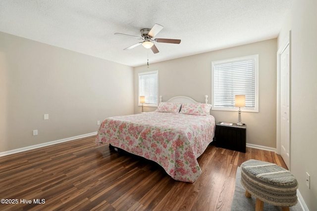 bedroom with ceiling fan, baseboards, a textured ceiling, and wood finished floors