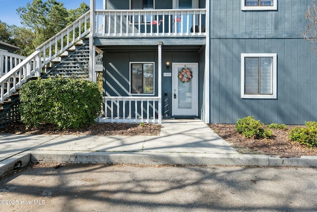 property entrance featuring covered porch