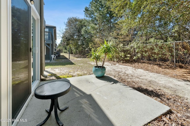 view of patio / terrace featuring fence