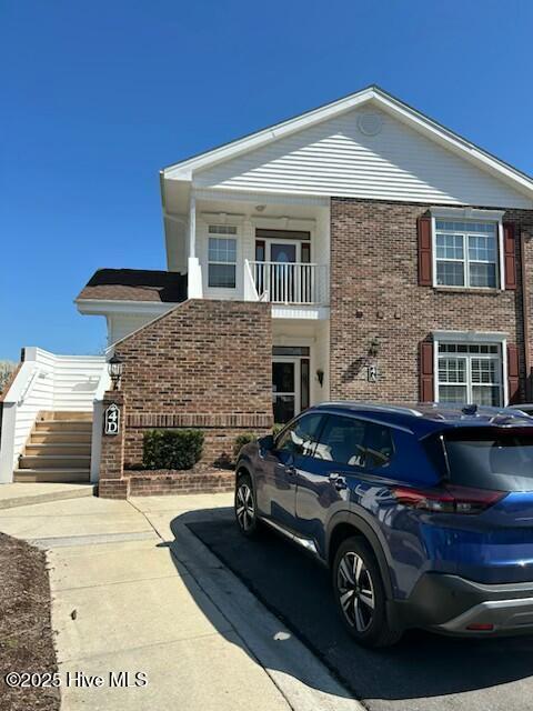 view of front of house featuring brick siding