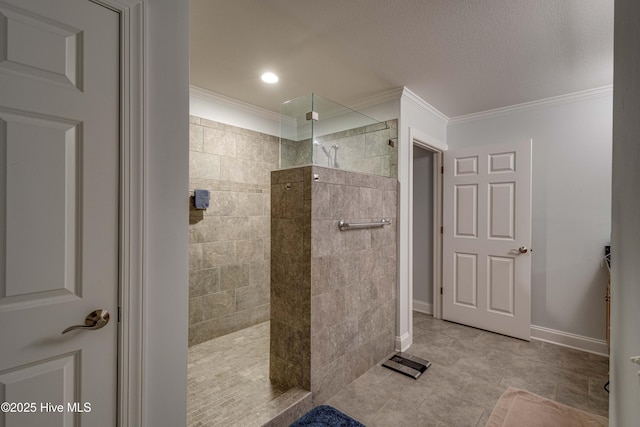 bathroom featuring crown molding, a textured ceiling, baseboards, and walk in shower