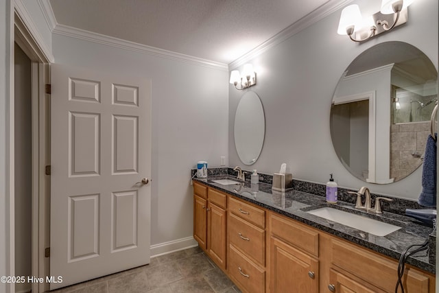 bathroom featuring double vanity, ornamental molding, and a sink