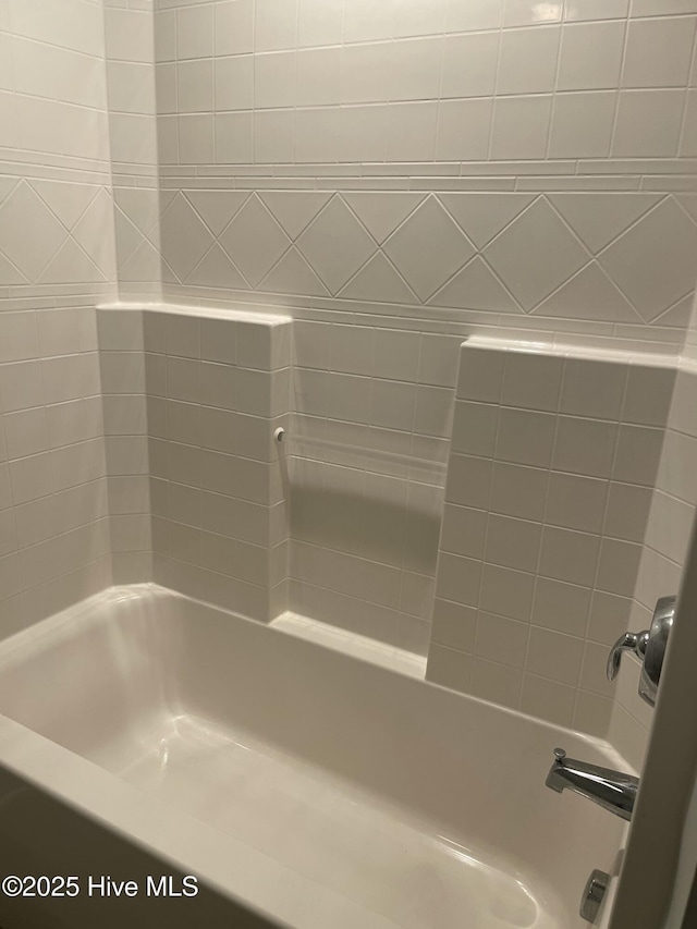 full bath featuring tub / shower combination