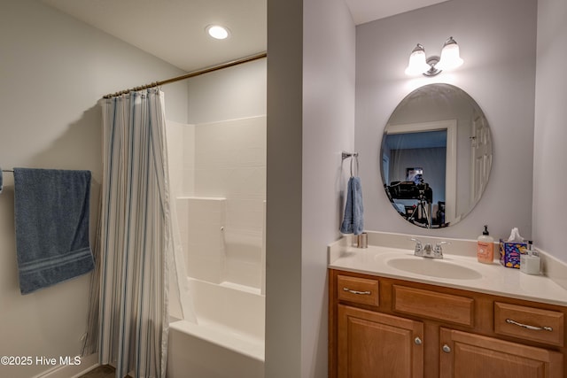 full bathroom featuring shower / bathtub combination with curtain and vanity