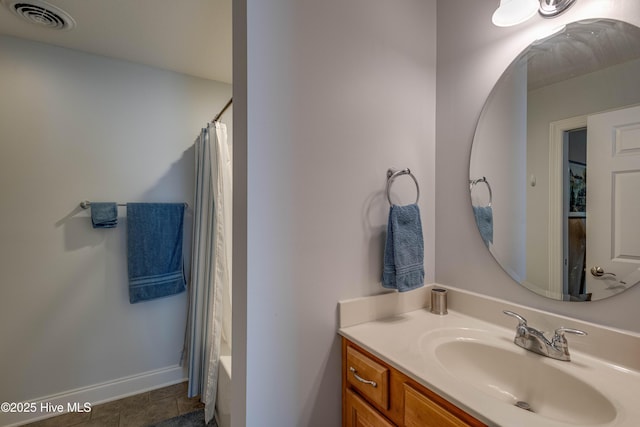 full bath featuring baseboards, visible vents, tile patterned flooring, and vanity