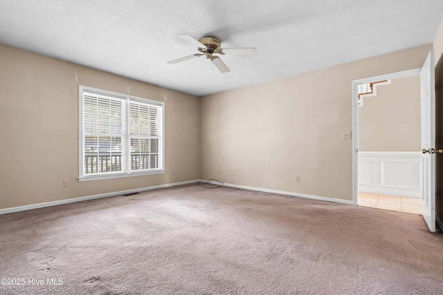 1611 Gores Landing Rd SW ., Unit Ocean Isle Beach, NC 28469 - spare room featuring carpet flooring, a textured ceiling, and ceiling fan