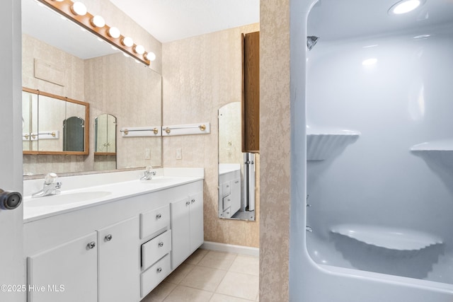 1611 Gores Landing Rd SW ., Unit Ocean Isle Beach, NC 28469 - bathroom with a sink, wallpapered walls, a shower, and tile patterned flooring