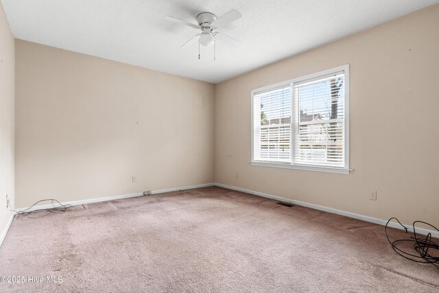 1611 Gores Landing Rd SW ., Unit Ocean Isle Beach, NC 28469 - carpeted spare room with a textured ceiling, baseboards, ceiling fan, and visible vents