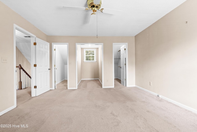 1611 Gores Landing Rd SW ., Unit Ocean Isle Beach, NC 28469 - unfurnished bedroom featuring baseboards, ceiling fan, a spacious closet, and carpet